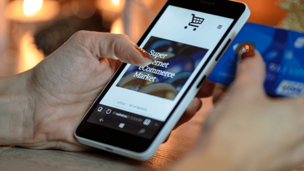 woman using phone to shop